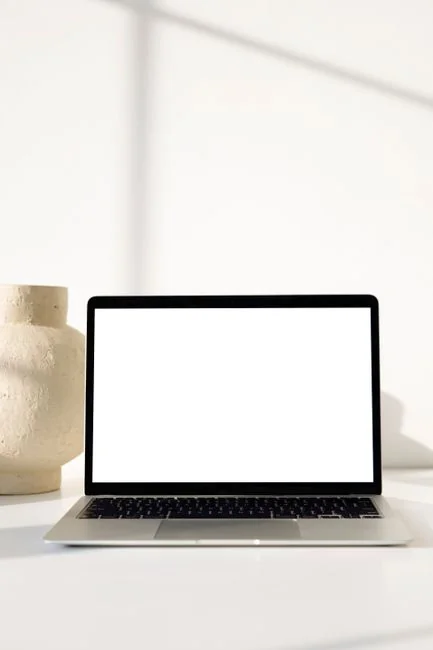 A contemporary computer screen showing web design work, presenting creative visuals in a workspace.